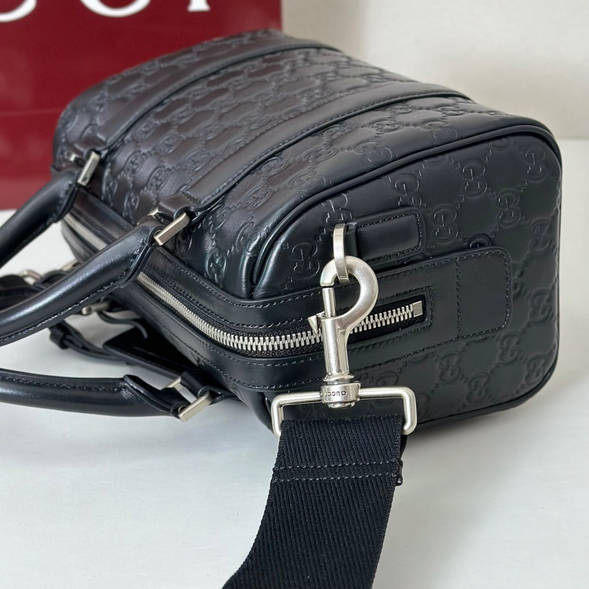 EMBOSSED LEATHER TOP HANDLE BAG