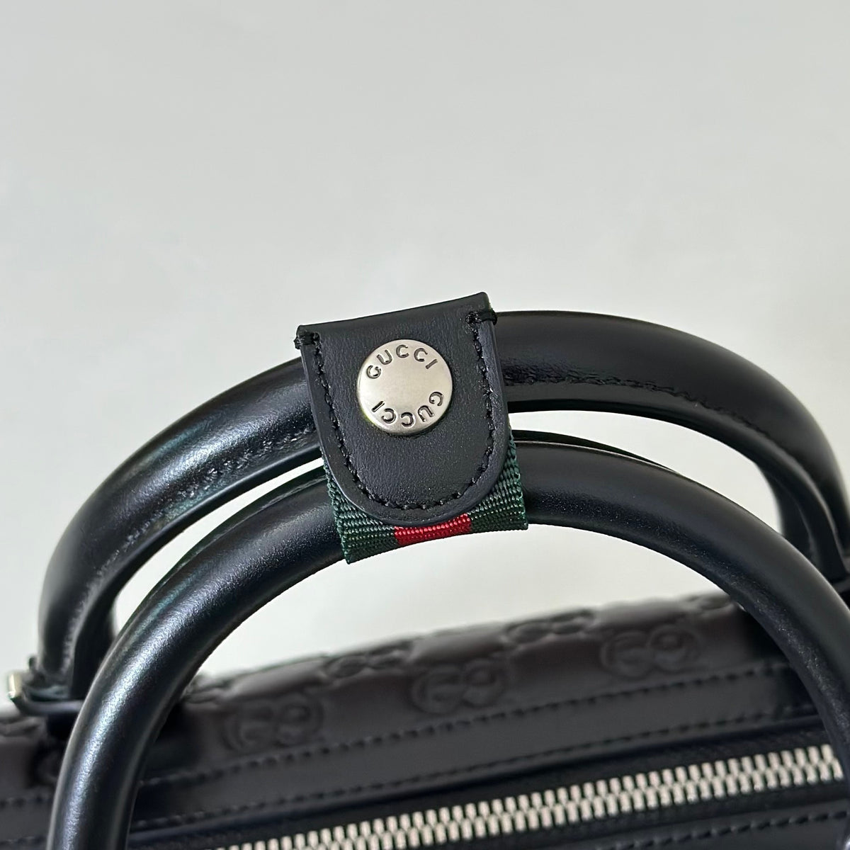 EMBOSSED LEATHER TOP HANDLE BAG