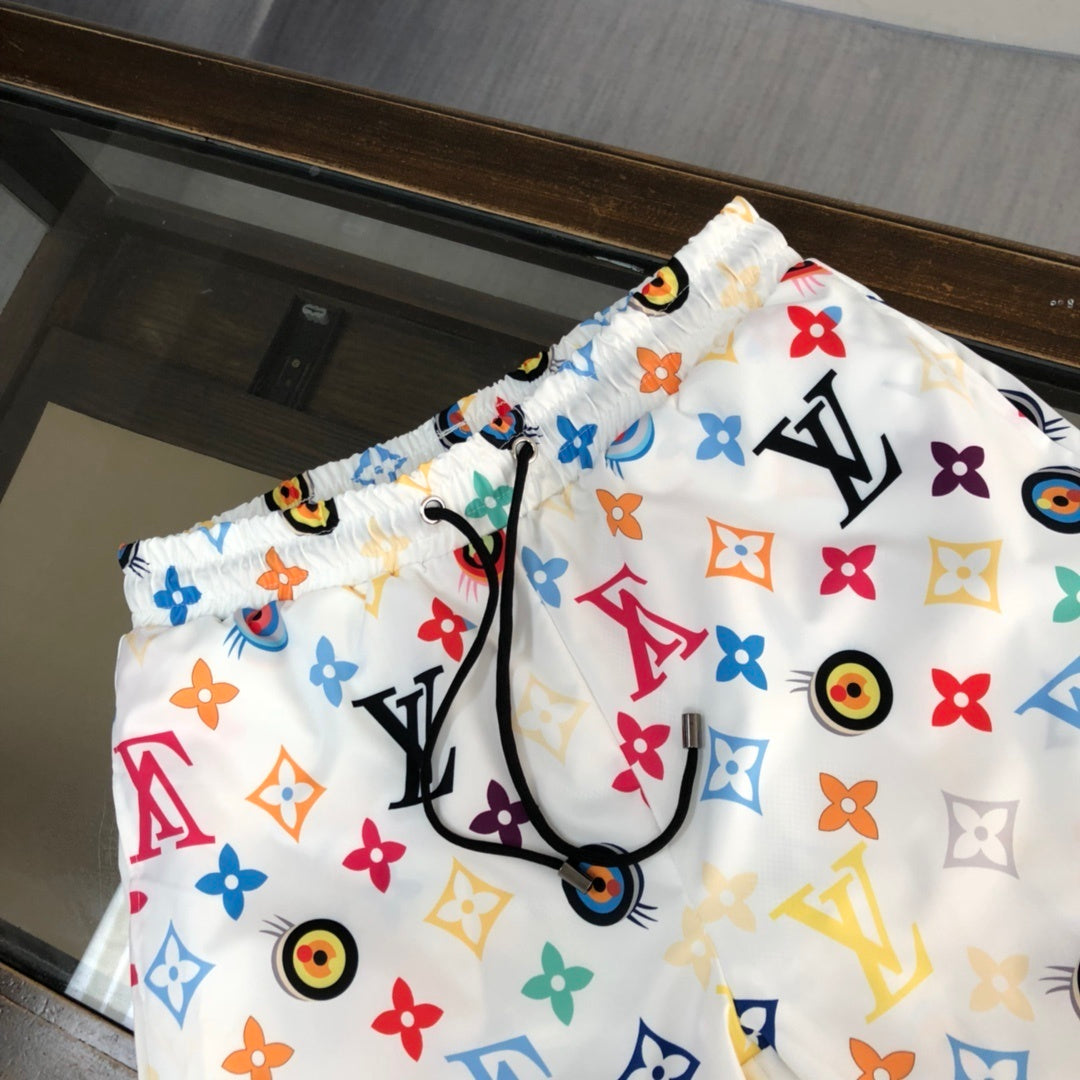 WHITE MULTICOLOR PRINT SWIM SHORTS