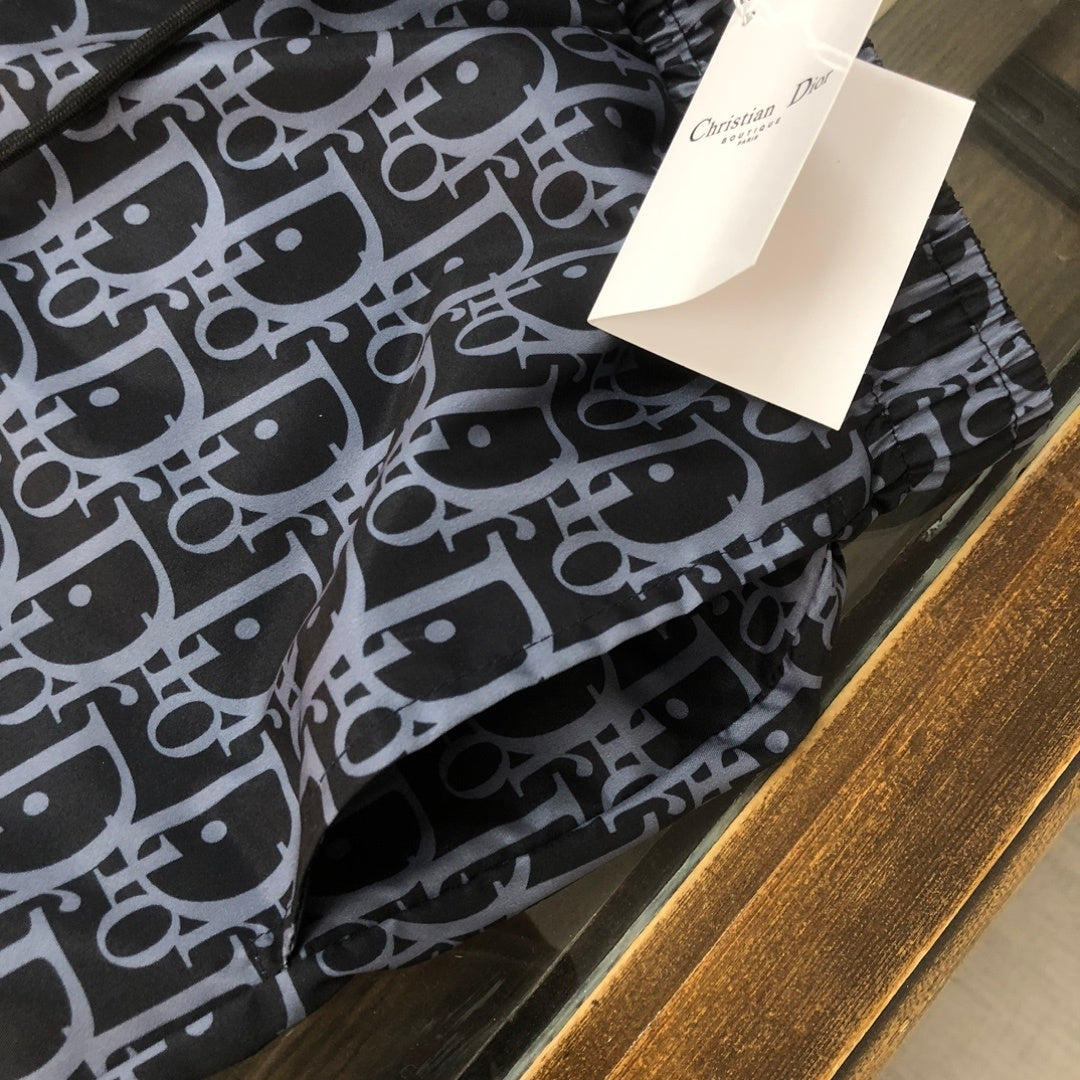 BLUE MONOGRAM PRINT SWIM SHORTS