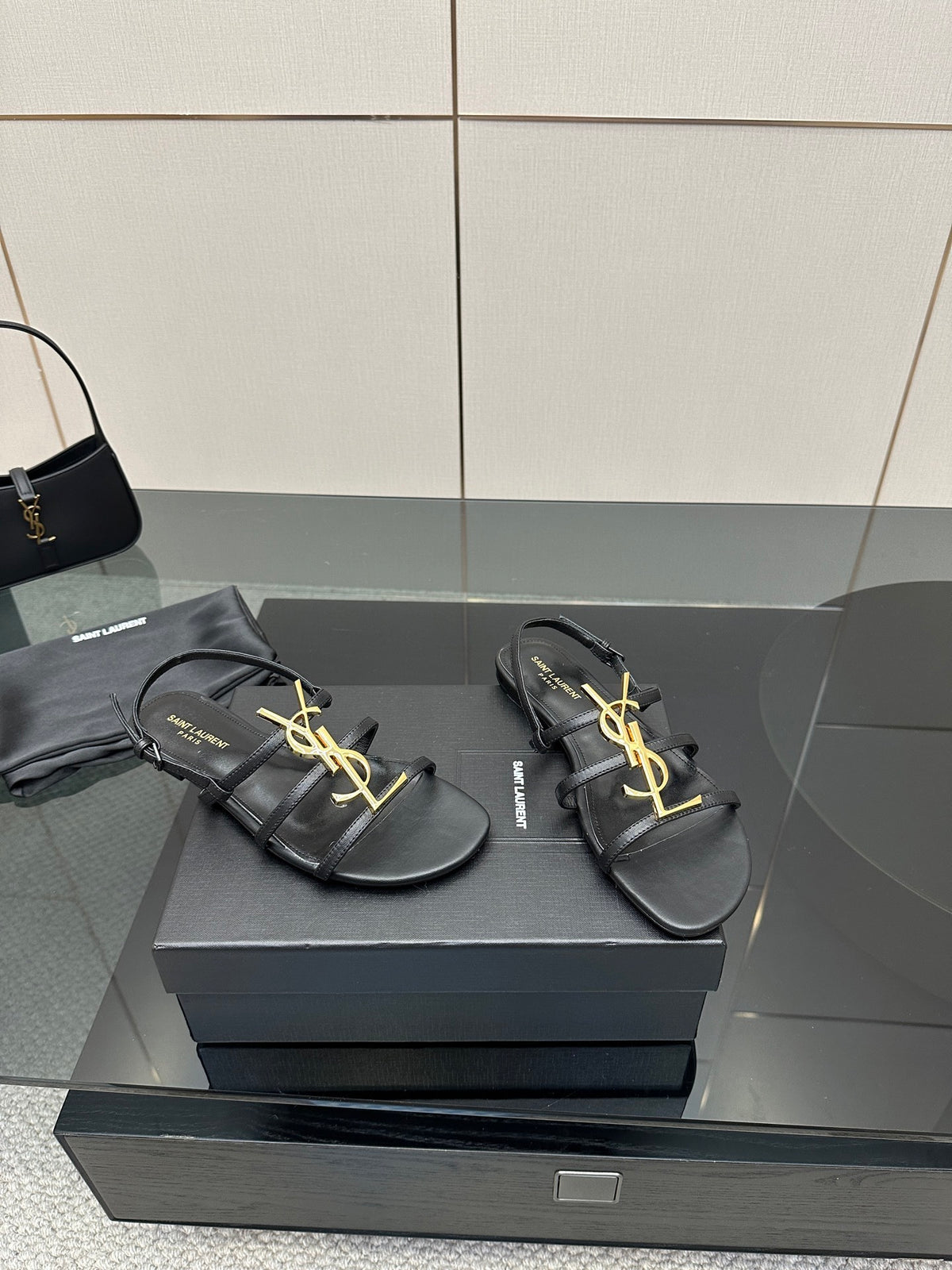 BLACK STRAPPY FLAT SANDALS WITH GOLD LOGO DETAIL